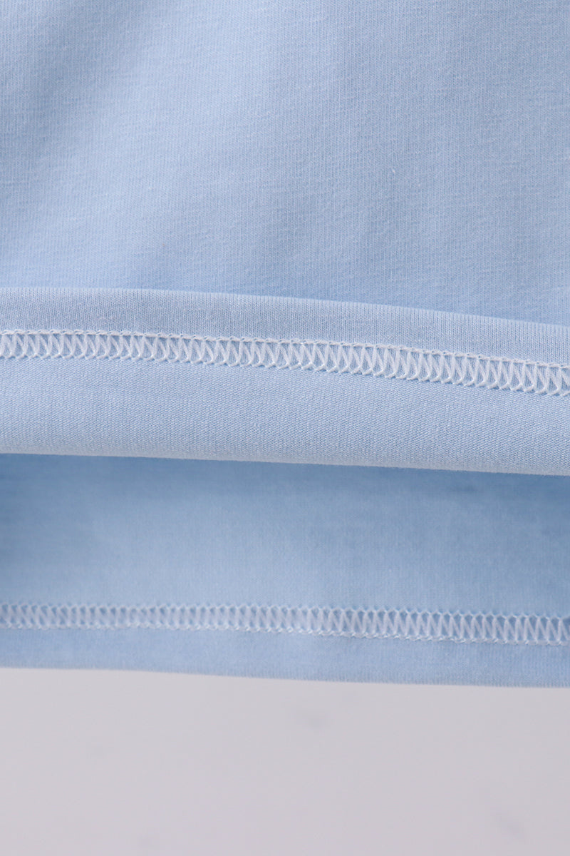 Blue construction embroidery top