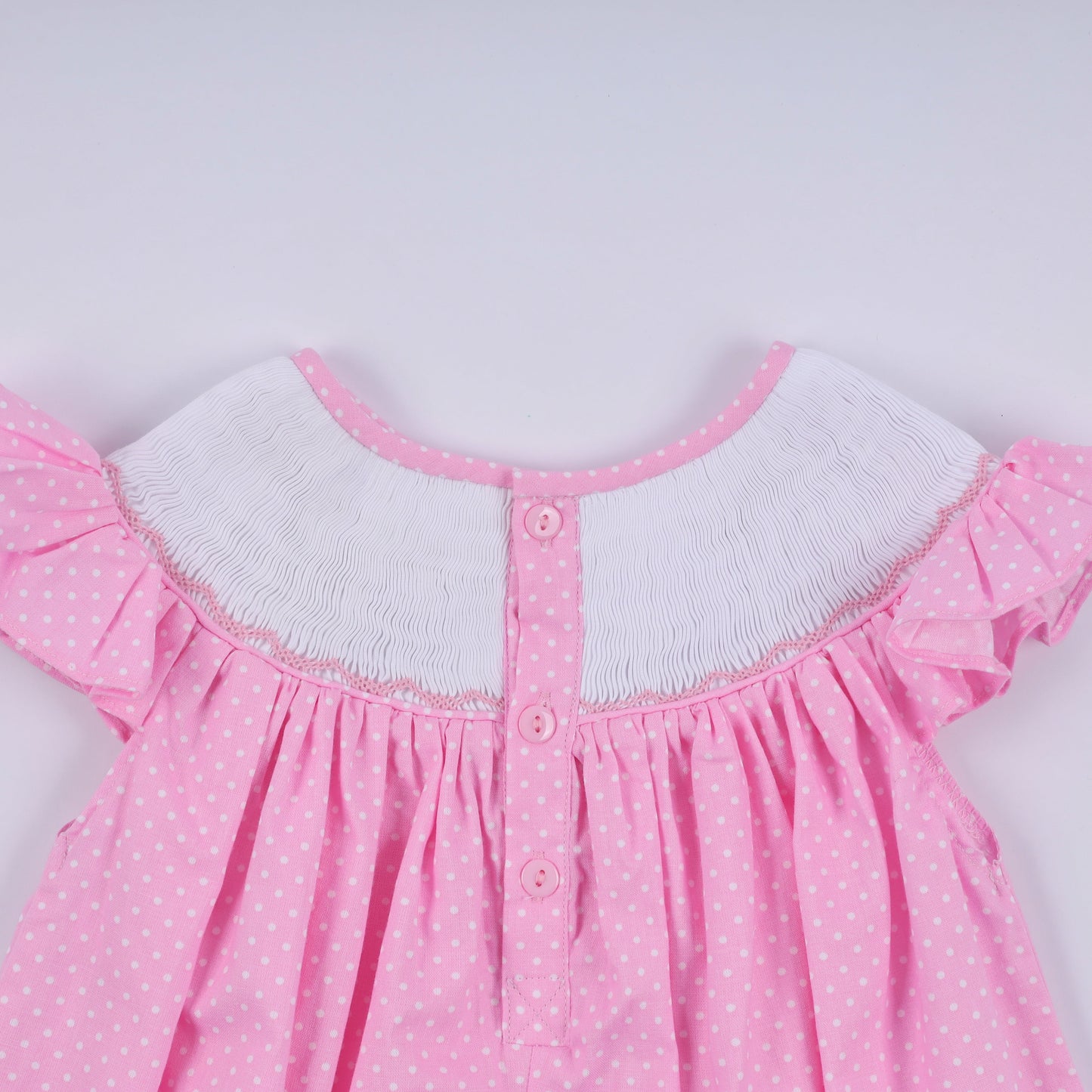 Pink character hand smocked dot ruffle dress