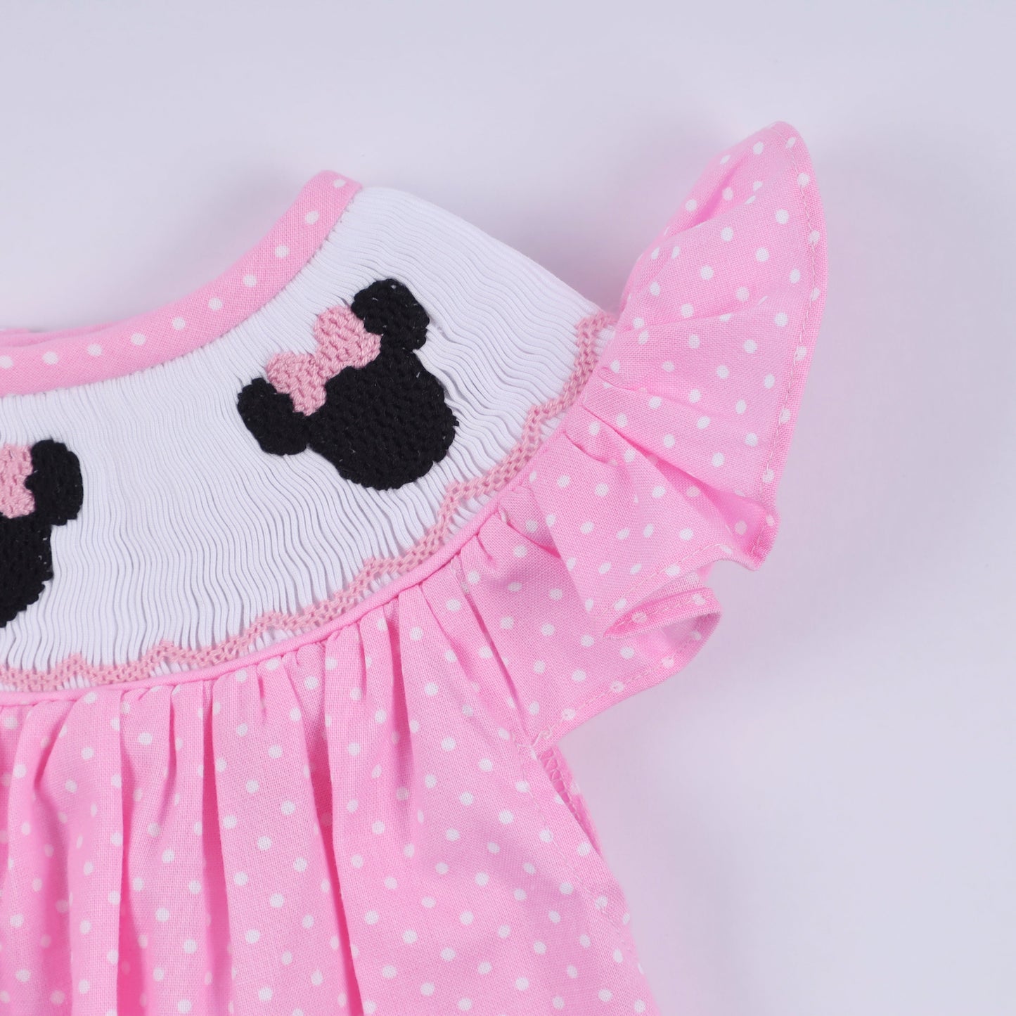 Pink character hand smocked dot ruffle bubble